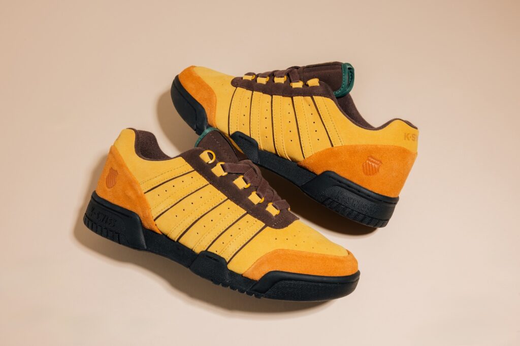 Anwar Carrots x K-Swiss KSRC GSTADD
Color: Nugget Gold/Pumpkin Spice/Black
Style Code: 74610-230-M