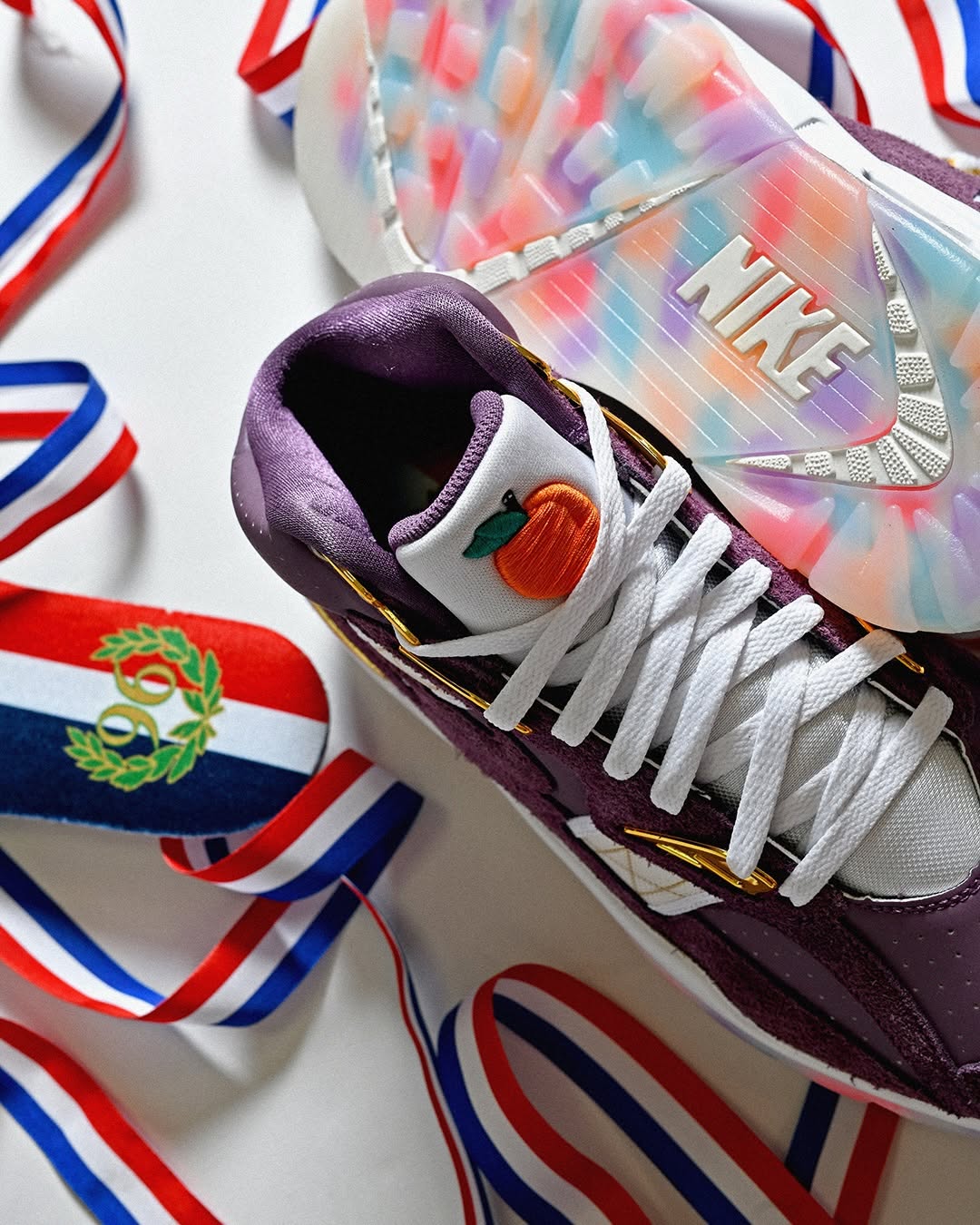 Nike Air Trainer SC Atlanta Olympics translucent outsole with multicolor confetti graphics.