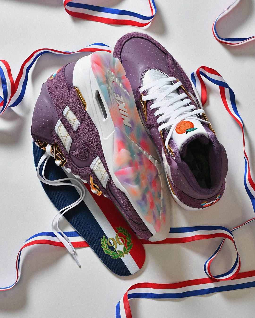 Nike Air Trainer SC Atlanta Olympics tongue with embroidered peach logo.